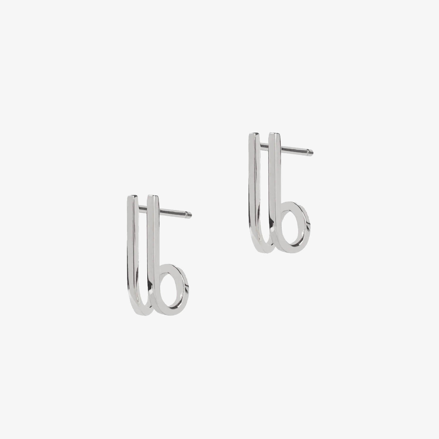 Silver curved bar earrings on a white background