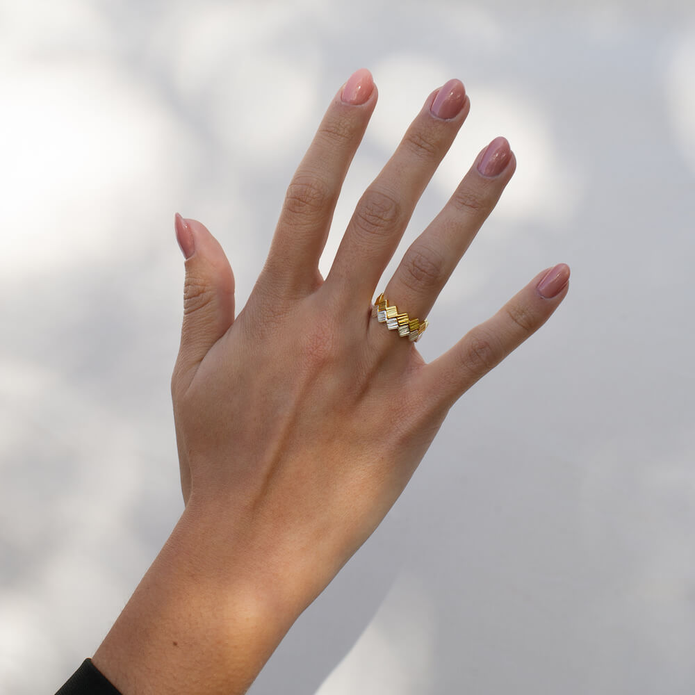 Woman's hand with two textured Matthew Calvin rings