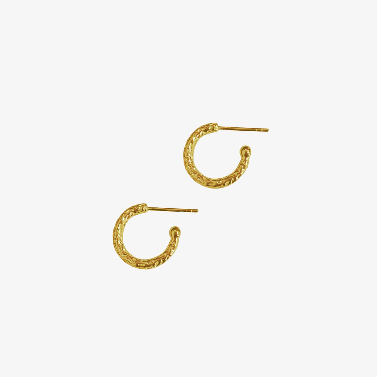 Small gold huggy hoops with a meteorite style textured finish on a white background