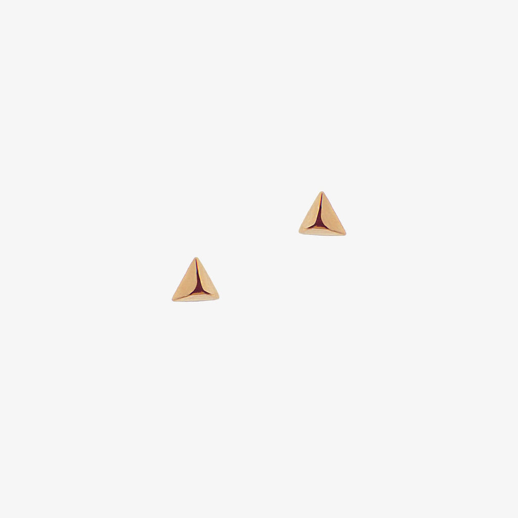 Dainty triangle rose gold earrings on a white background