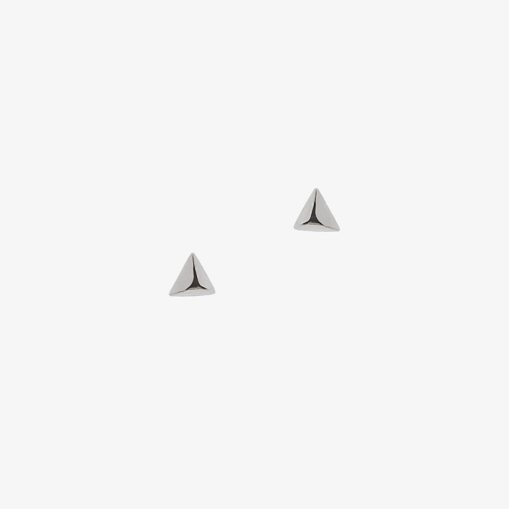 Silver pyramid shaped studs on a white background