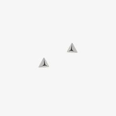 Silver pyramid shaped studs on a white background